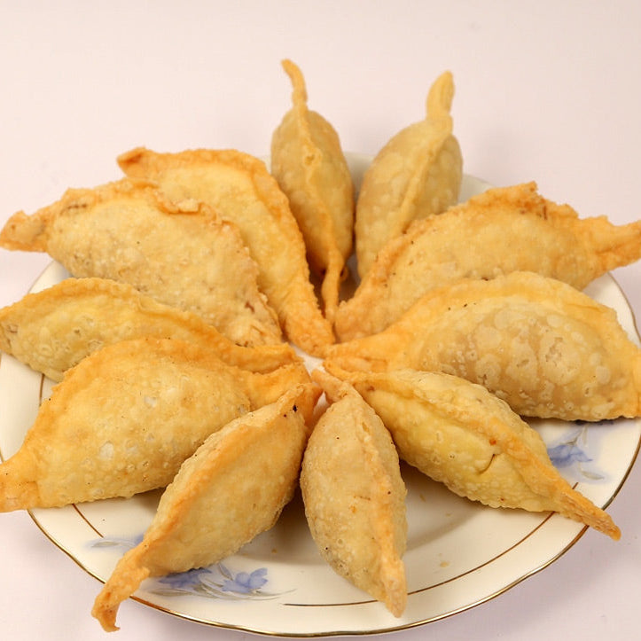 Traditional Andhra sugar kajjikayalu sweet with crispy outer layer and rich sweet filling.