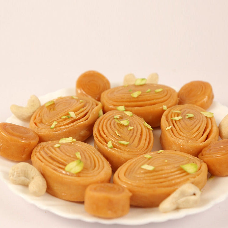 Crispy layered madatha kaja sweet soaked in sugar syrup, a famous Andhra dessert.