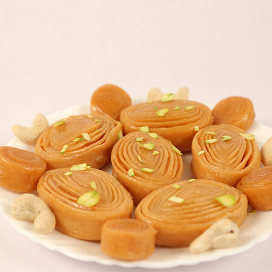 Crispy layered madatha kaja sweet soaked in sugar syrup, a famous Andhra dessert.