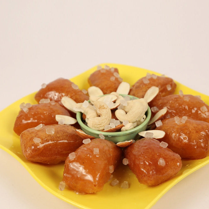 Famous Andhra Kakinada kaja sweet with flaky layers and juicy syrup sweetness.