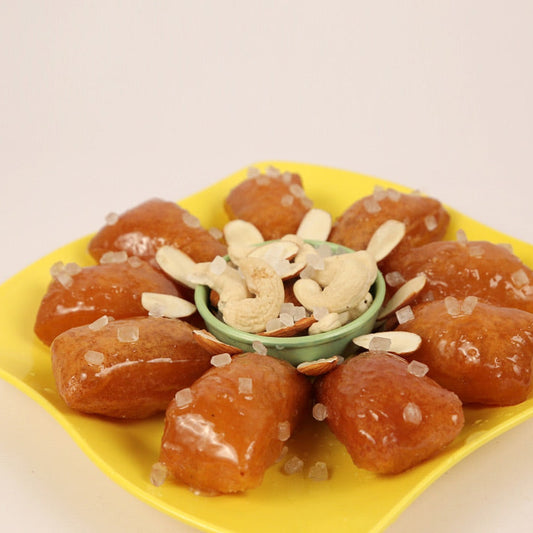 Famous Andhra Kakinada kaja sweet with flaky layers and juicy syrup sweetness.
