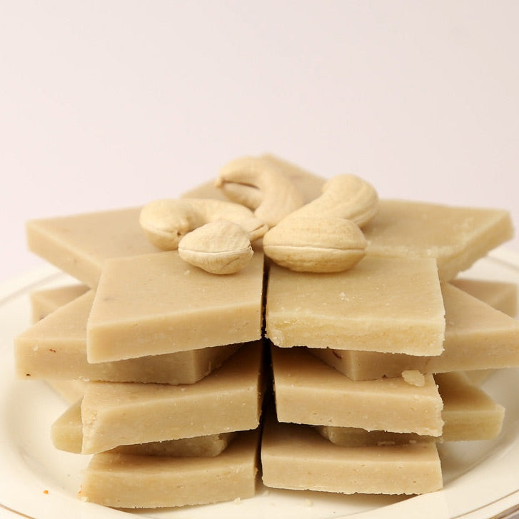 Premium Cashew Burfi topped with whole cashews, prepared in traditional Andhra style by Athithi Gruha Foods.

