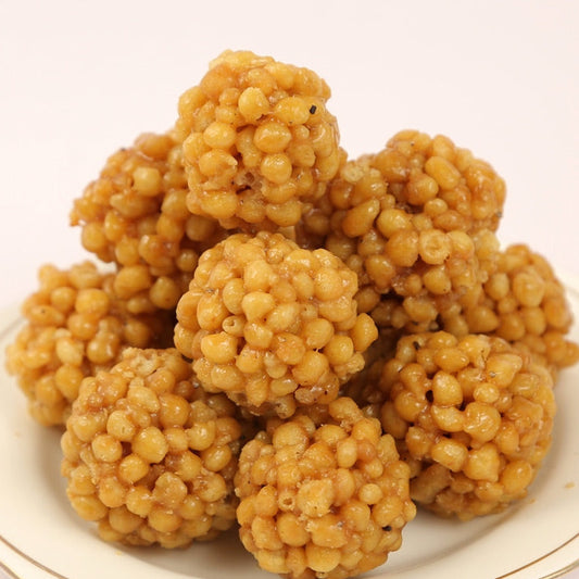 A plate of traditional Bellam Mitai Laddu sweets