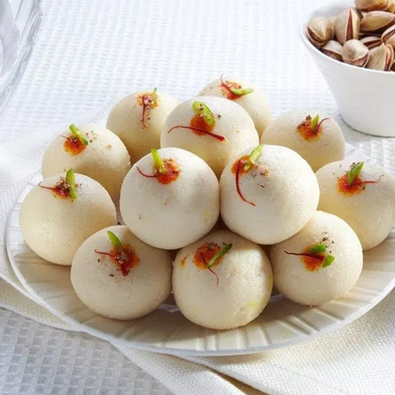 Soft and rich malai laddu sweet prepared with creamy milk solids and aromatic flavors.
